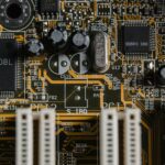 A top-down photo of a gold-plated motherboard