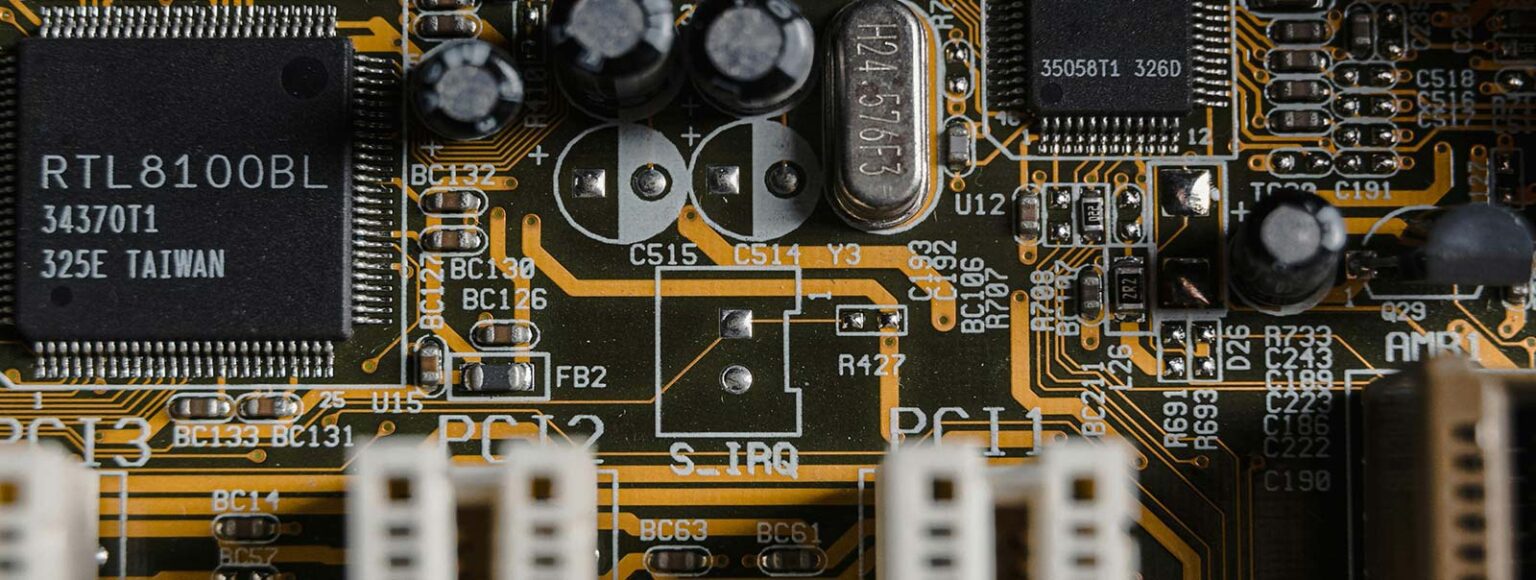 A close-up photo of a computer’s motherboard with plated components