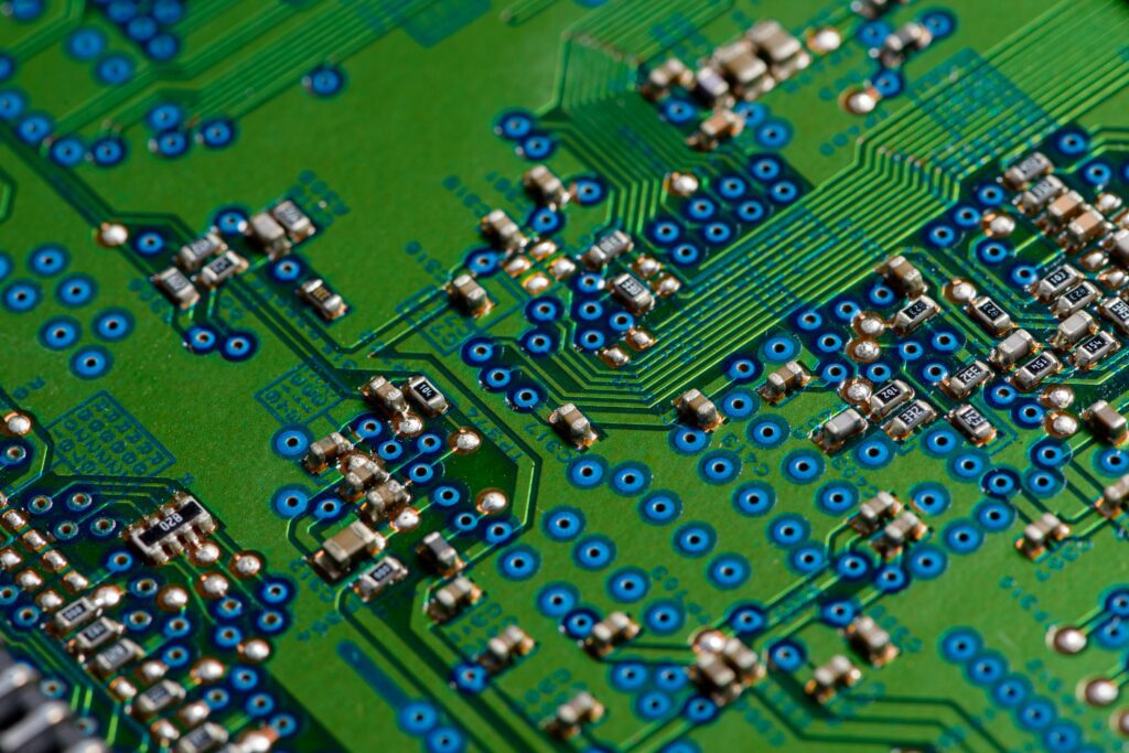 A close-up of a circuit board with small silver-plated components