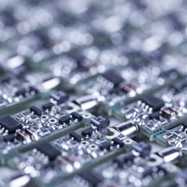Closeup of silver-plated microcircuits.
