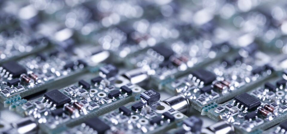 Closeup of silver-plated microcircuits.