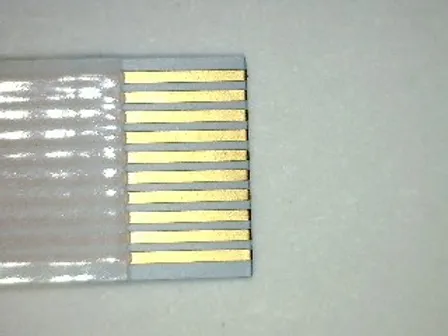 A flexible flat cable with gold-plated connector pins.