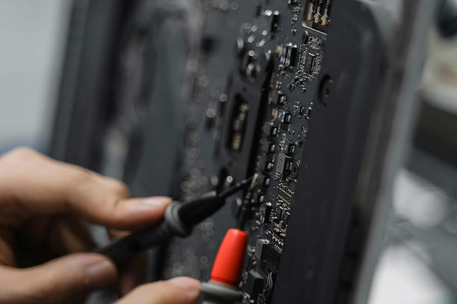 A technician working on a circuit board