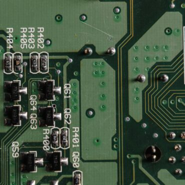 Close-up shot of a PCB showing SMT components and solder joints.