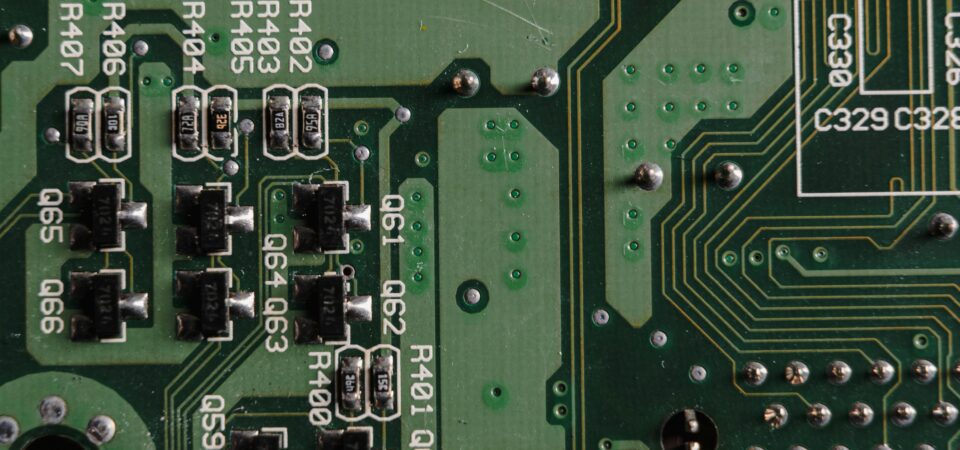 Close-up shot of a PCB showing SMT components and solder joints.