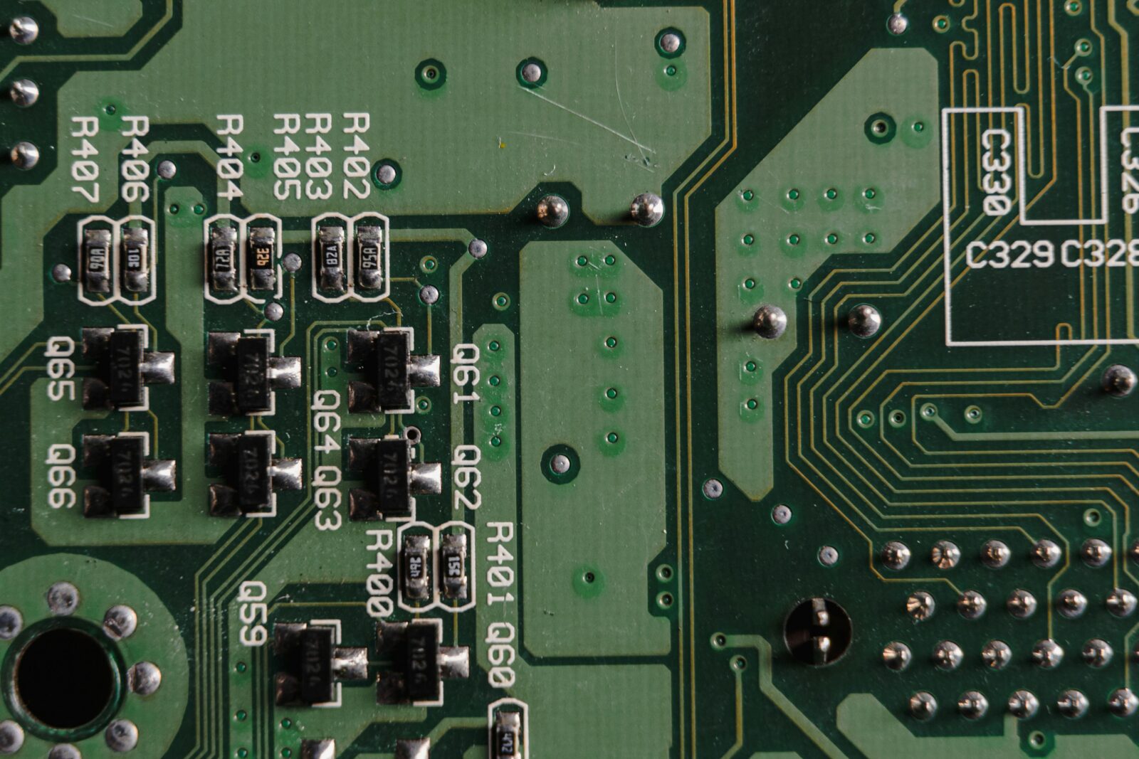 Close-up shot of a PCB showing SMT components and solder joints.