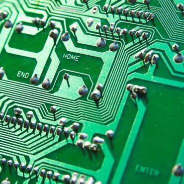 Up close shot of a green circuit board with PCB metal finishes
