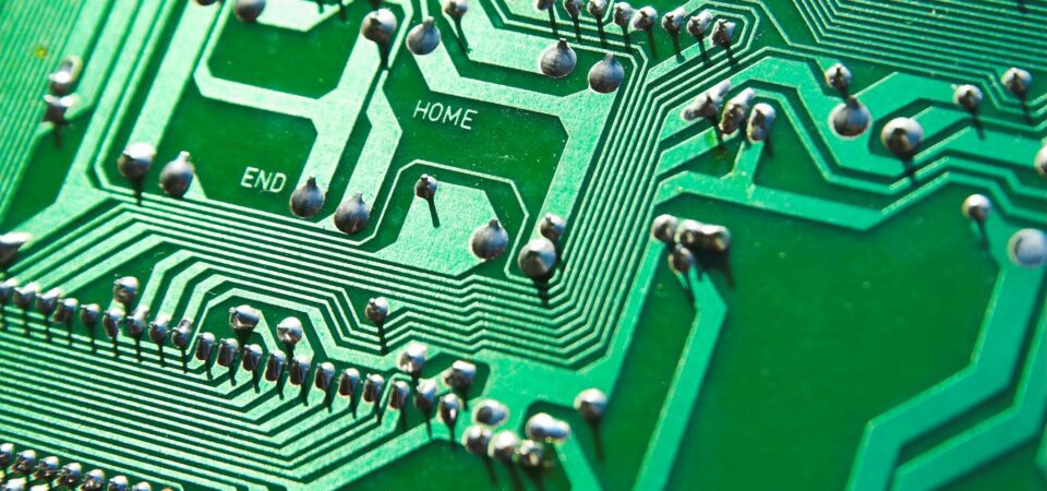 Up close shot of a green circuit board with PCB metal finishes