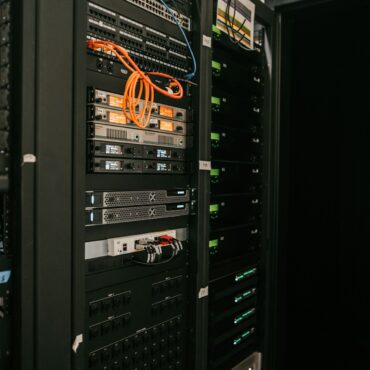 Black storage racks in a large server room
