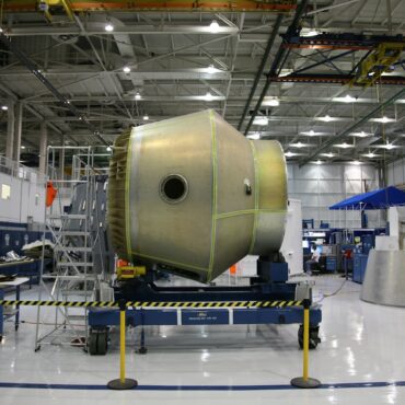 Large aerospace component positioned in a controlled manufacturing facility