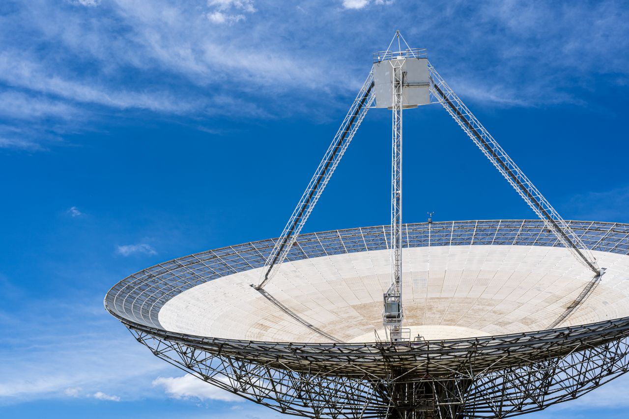 A satellite dish against a blue sky
